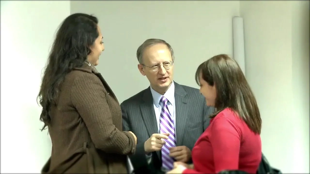 Members of Maria’s family speaking with Dr. Zbigniew Wszolek
